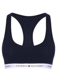Navyblauwe sportbeha met racerback-ontwerp, gemaakt van zacht materiaal, met een witte elastische band met het logo "TOMMY HILFIGER".