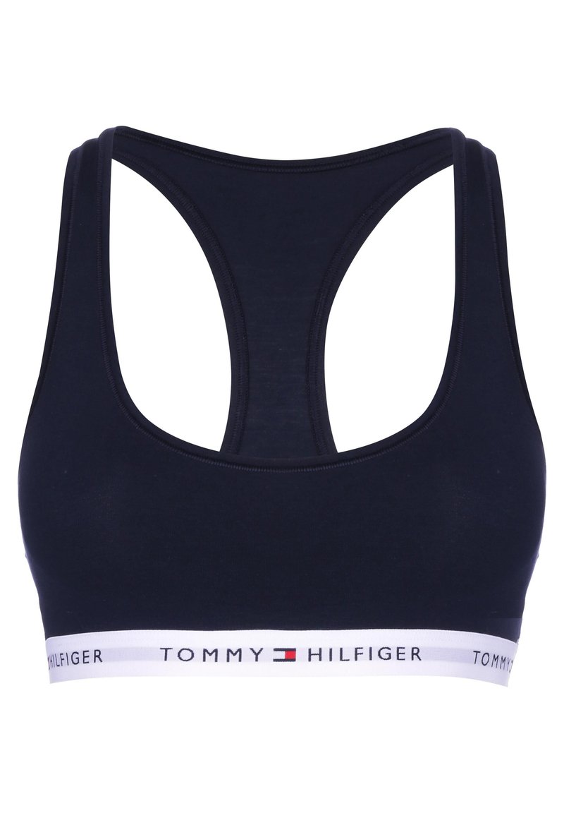 Navyblauwe sportbeha met racerback-ontwerp, gemaakt van zacht materiaal, met een witte elastische band met het logo "TOMMY HILFIGER".