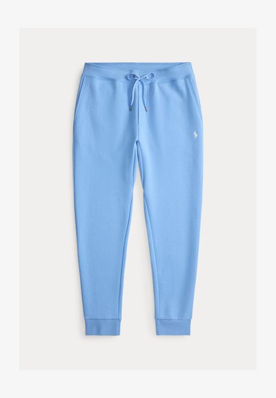 Jasnoniebieskie polarowe spodnie dresowe ze ściągaczem w pasie, kieszeniami bocznymi, ściągaczami na końcach nogawek i małym białym wyszywanym logo na lewym udzie.