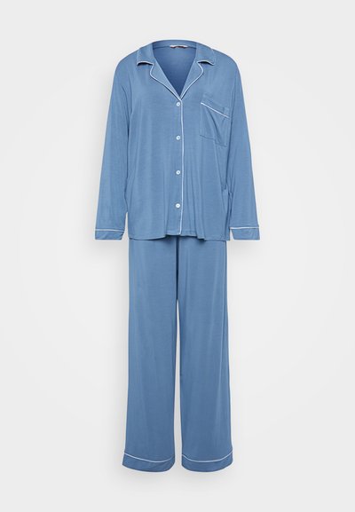 Light blue pajama set featuring long sleeves, a button-up top with a pocket, and matching wide-leg pants with white piping accents.