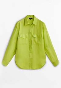 Lime green long-sleeve shirt made of textured fabric, featuring a pointed collar, two chest pockets, and a curved hemline.
