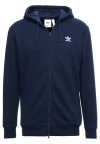 Mörkblå zip-up hoodie i mjuk bomull, med en kenguruficka, justerbar huva och vit adidas-logotyp på vänster bröst.