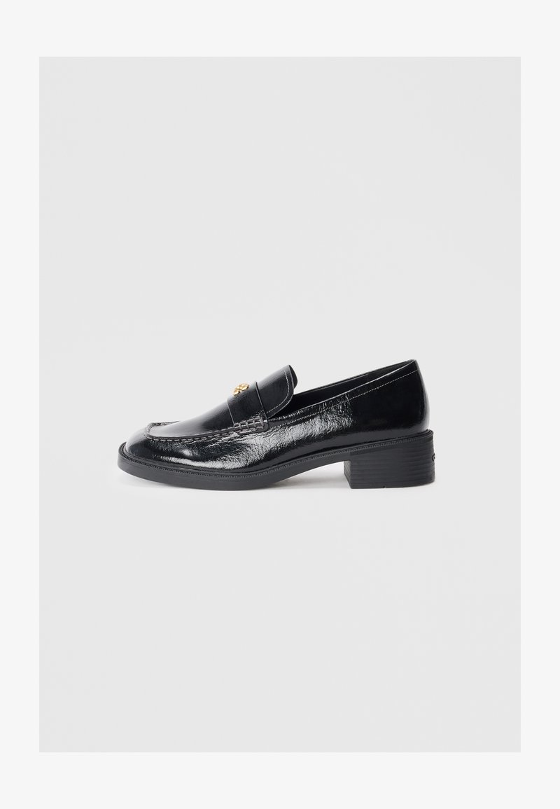 Black patent leather loafers with a low block heel, featuring a stitched design and gold-toned decorative accents on the upper.