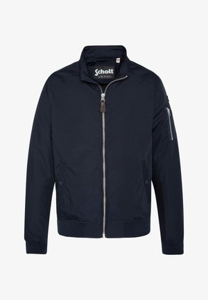 Marineblauwe bomberjack met een ritssluiting aan de voorkant, een hoge kraag, zijzakken en een met rits afgesloten mouwzak. Gemaakt van gladde stof met ribgebreide manchetten.