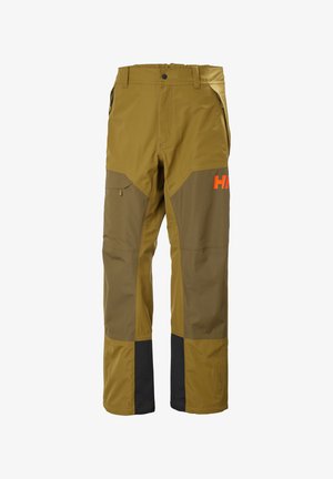 Outdoor-Arbeitshose in Braun und Senfgelb mit verstärkten Knien, seitlichen Reißverschlusstaschen, Gürtelschlaufen und einem orangefarbenen Teil-Logo am Oberschenkel.