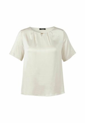 Cream-colored short-sleeve blouse with round neckline, subtle pleats, and a small gold bar detail below the collar, displayed on white background.