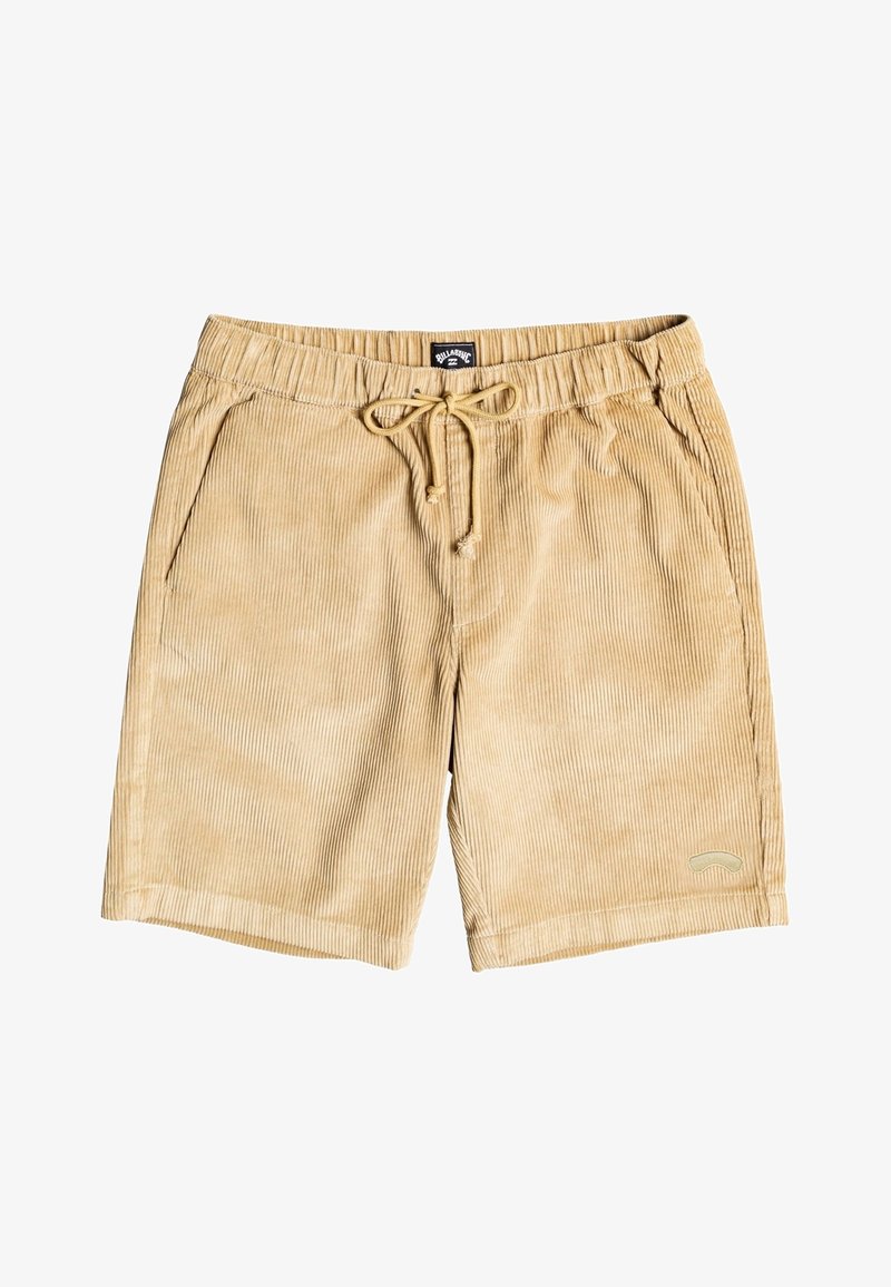 Shorts en velours beige avec taille élastique, cordon de serrage, poches latérales et un petit logo courbé près de l'ourlet sur la jambe droite.