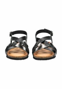 Černé kožené sandály s křížovými pásky a sponou na kotníku. Plná podrážka s korkovou texturou a jemná vnitřní podšívka.