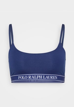 Navy blue bra made of ribbed fabric with adjustable straps and a contrasting white "POLO RALPH LAUREN" logo band at the bottom.