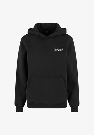 Črna kapuco ima pulover iz bombaža, z sprednjim žepom in belim besedilom "mir" v stilizirani pisavi na levem prsnem delu.
