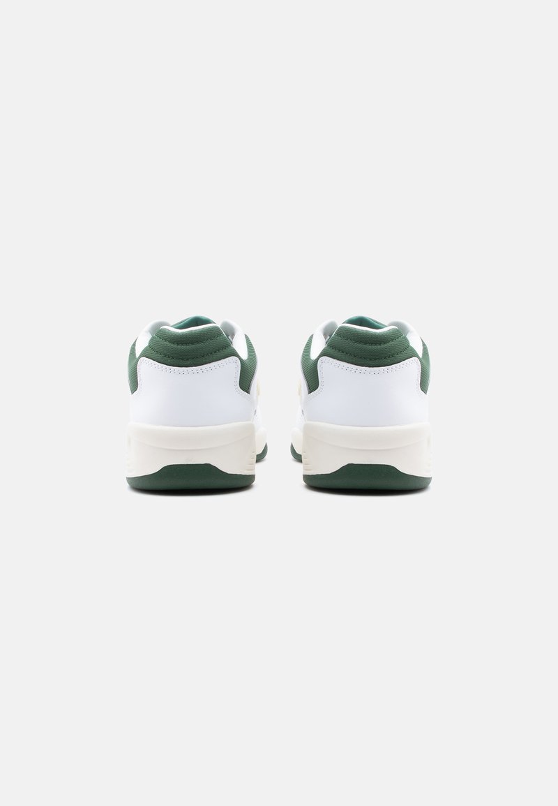 Pair of white and green sneakers shown from the back on a plain white background.