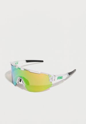 Sport sunglasses with a transparent frame, green and yellow gradient lenses, black tips, and a logo on the top bar. Lightweight design.
