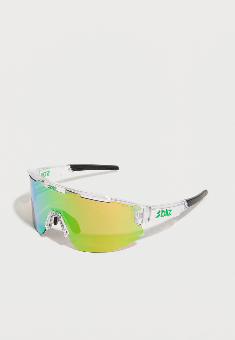 Lunettes de sport avec une monture transparente, des verres dégradés verts et jaunes, des embouts noirs et un logo sur la barre supérieure. Design léger.