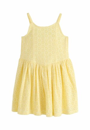 Žlté šaty bez rukávov s tenkými ramienkami a látkou z dierkovanej čipky, s priliehavým živôtikom a nariasenou sukňou.