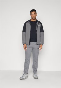 Columbia MERIDIAN CREEK™ JOGGER - Spodnji deli trenirk - city grey heather