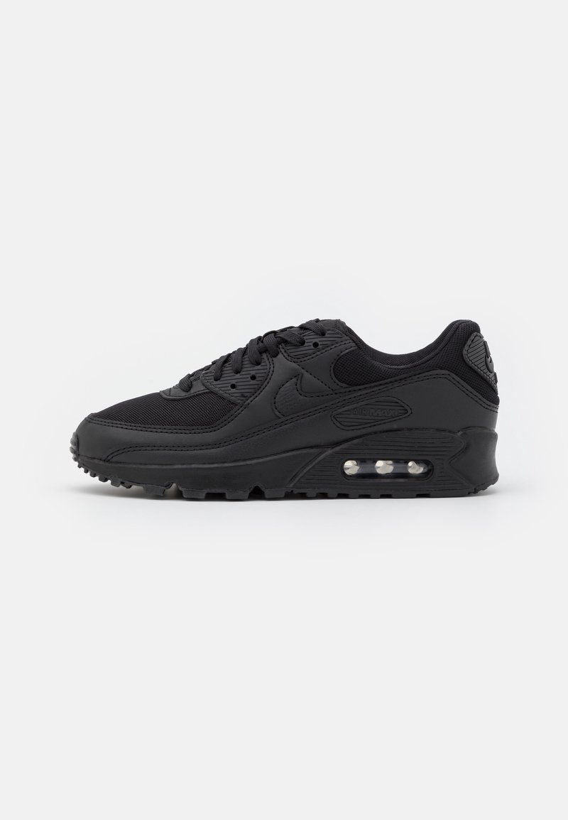 Baskets Nike Air Max noires avec semelle à coussin d'air visible, dessus en mesh et cuir, et fermeture à lacets, vues de côté.