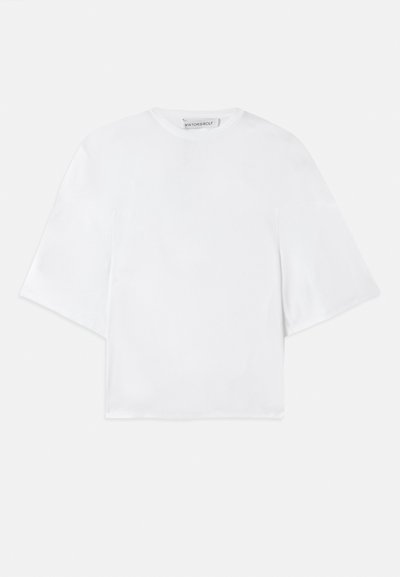 Witte, losse korte mouwen shirt met brede mouwen en een ronde halslijn, gelabeld met Viktor&Rolf aan de binnenkant van de kraag.