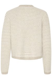 Vaalean beige neulepaita, jossa on kohotetut raidat kuosisuunnittelussa, pyöreä kaula-aukko ja pitkät hihat. Paita on lyhyt malli.