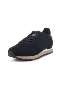Navy athletic shoe with mesh and suede materials, rounded toe, textured upper, and a light-colored rubber sole with speckled accents.