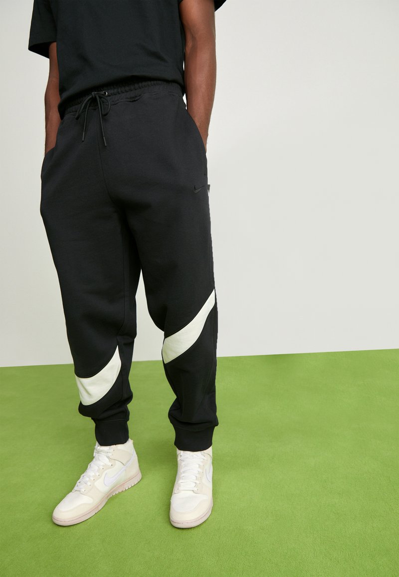 coconut milk swoosh tracksuit