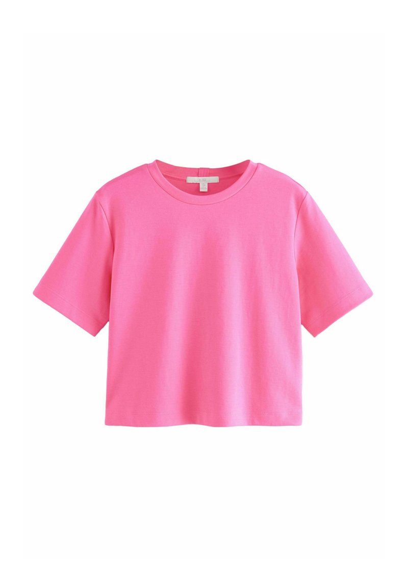 Camiseta de manga corta y cuello redondo en un vibrante color rosa, fabricada con algodón de textura suave y un corte relajado.