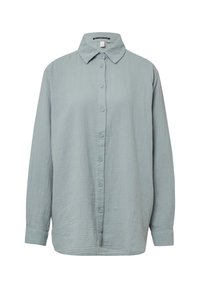 Lys blå skjorte med knapper foran lavet af tekstureret stof med klassisk krave, lange ærmer og lige snit, med seks knapper foran.