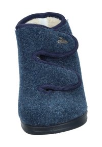 Navy blue slipper made of textured felt with a soft lining, featuring a wraparound design and decorative laces on the front.