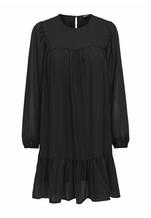 Svart långärmad klänning med volang nederkant, tillverkad av lättviktigt tyg. Har en rund halsringning och en nyckelhålsknäppning i ryggen.