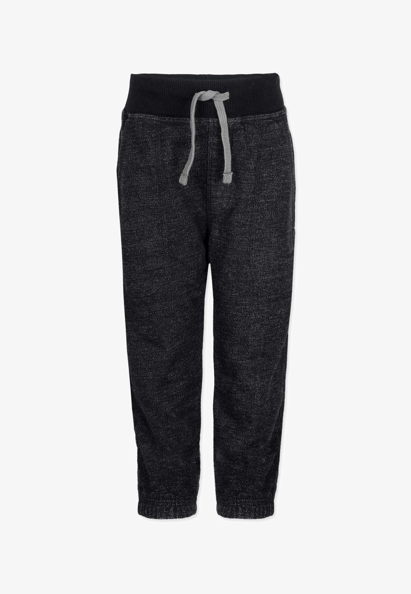 Black, textured jogger pants with a drawstring waist, tapered fit, and elastic ankle cuffs. Made from soft fabric for comfort and flexibility.