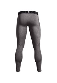 Grijze sportleggings met een getailleerd ontwerp, gemaakt van rekbaar materiaal, met een zwarte merkband aan de taille en naadloze constructie.