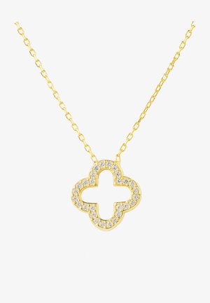 Collana in oro con un pendente a forma di quadrifoglio, incastonato con strass trasparenti, creando un effetto scintillante su una superficie liscia.