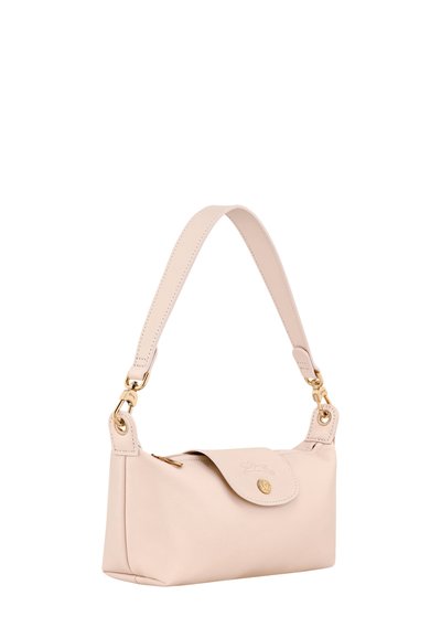Small blush pink leather handbag with short strap, gold hardware, and a flap closure with embossed logo and button.