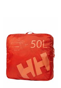 Sac rouge compact Helly Hansen d'une capacité de 50L, avec fermeture éclair, poignée et un schéma de taille indiquant des dimensions de 60 cm par 30 cm sur le panneau avant.