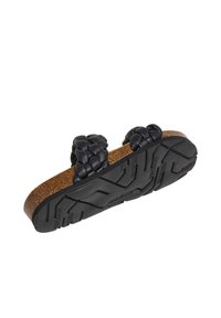 Black leather sandals with woven accents, cork footbed, and textured rubber outsole. Lightweight design with a flat profile.
