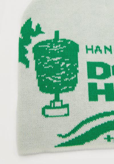 Πράσινο πλεκτό γράφημα μιας λάμπας και φύλλων σε λευκό φόντο, με μερικό κείμενο "HAND" και "DO H" ορατό.