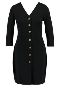 Musta mekko, jossa on V-pääntie, kolme neljänneskäsivartta ja napitettava etuosa, jossa on kultasävytteiset napit ja istuva siluetti.