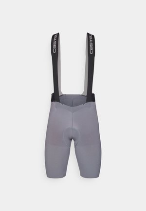 Shorts de cyclisme gris avec bretelles noires. Le tissu a une texture lisse avec des coutures renforcées et un insert rembourré pour le confort.