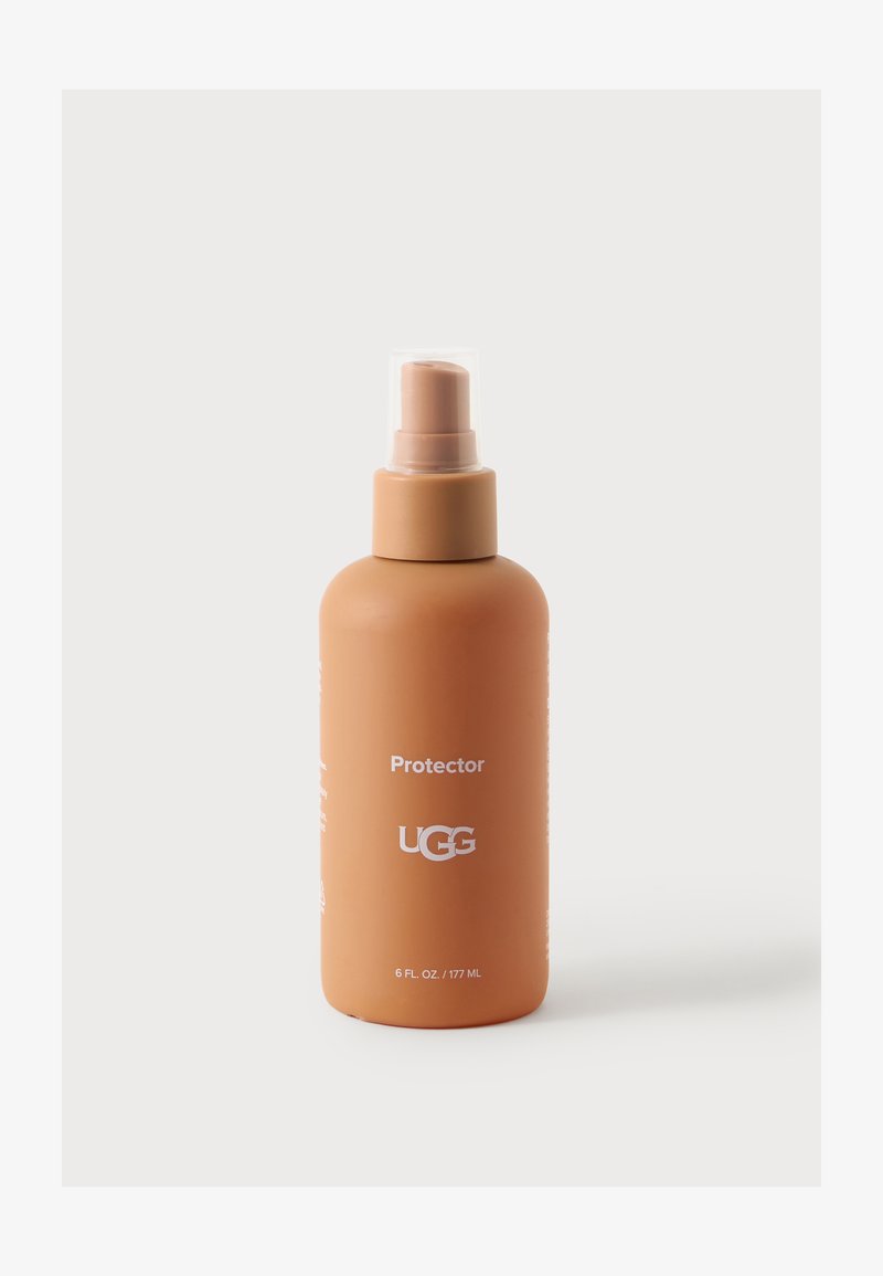 Bouteille spray en plastique marron étiquetée Protector UGG avec capuchon transparent, contenant 6 onces liquides ou 177 millilitres de produit.