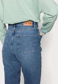 NA-KD Tall Relaxed fit -farkut - light blue