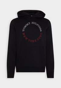 Hoodie in cotone nero con tasca frontale, cappuccio con cordino e grafica circolare con "TOMMY HILFIGER" e "NEW YORK CITY" in testo rosso e bianco.