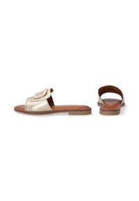 Gold metallic slide sandals with a wide front strap and a decorative buckle detail. Open back design, brown leather insole, and flat sole.