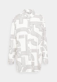Chemise blanche boutonnée avec motifs abstraits en lignes noires, dotée d'un col et de manches longues, en tissu léger.