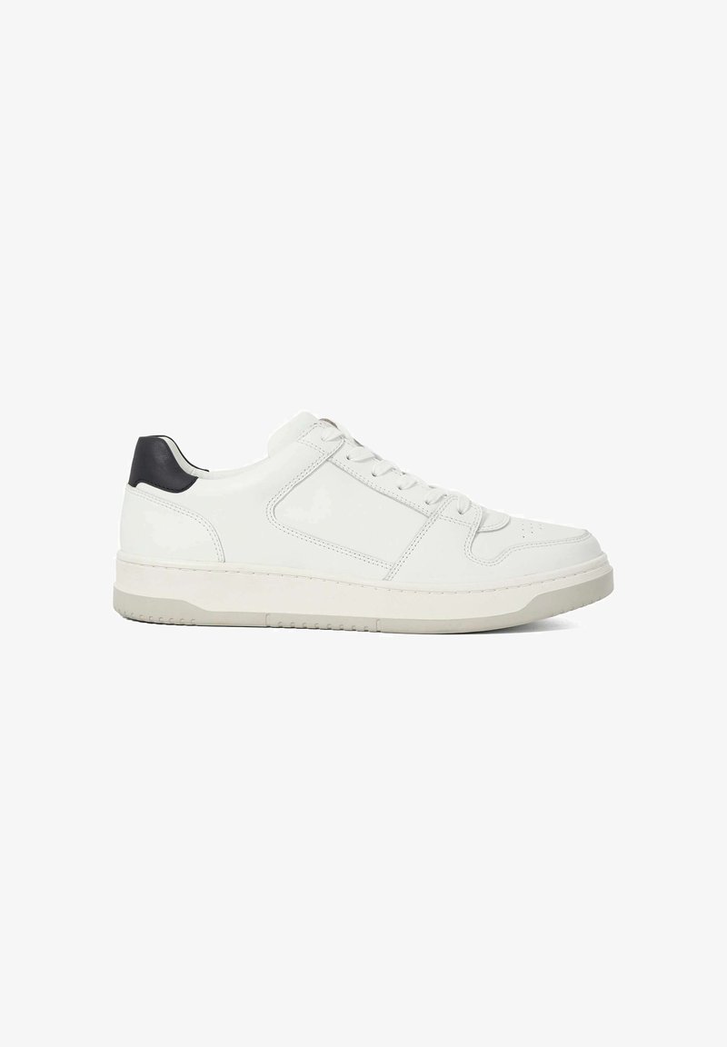 White leather sneaker featuring a low-top design, round toe, and minimal stitching details; accented with a dark heel tab and beige sole.