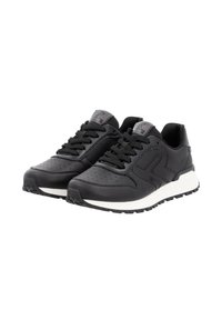 Black athletic shoes with a smooth leather upper, perforated detailing, thick white midsole, and rugged black outsole. Laces and padded collar included.