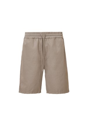 Beige puuvillashortsit elastisella vyötäröllä, säädettävällä nyörillä ja sivutaskuilla. Sujuva pinta ja polvenpituisuus.