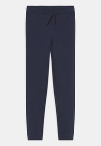 Pantaloni tuta blu navy realizzati in tessuto morbido, con una fascia elastica in vita con lacci, vestibilità slim e polsini alla caviglia.