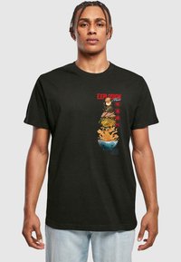 Black cotton t-shirt featuring colorful graphics of a bowl with food, text reading "EXPLOSION," and Asian motifs. Short sleeves and crew neck.