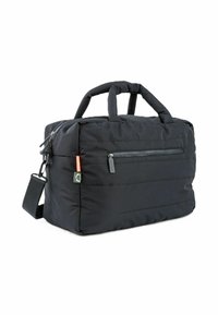 Black quilted duffel bag with dual padded handles, detachable shoulder strap, and zippered front pocket on a white background.