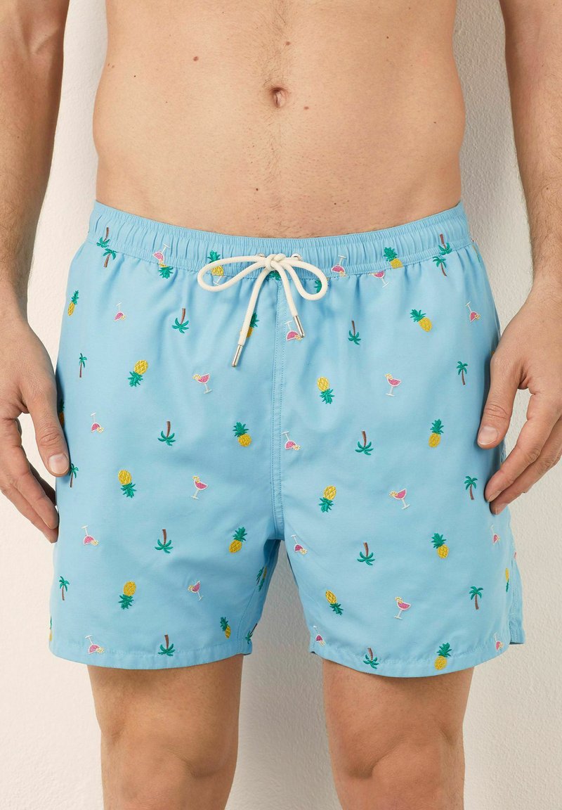 Blauwe zwemshorts met elastische tailleband en trekkoord. Voorzien van meerkleurige geborduurde ontwerpen van ananassen, drankjes en palmbomen.