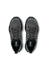 Pantofi sport gri, cu o parte superioară din plasă, talpă din cauciuc închis la culoare și accente reflectorizante. Design cu șireturi și o bandă de prindere la spate.